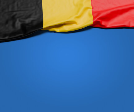 The wrinkled flag of Belgium draped onto a flat blue background with shadow. Copy space for message