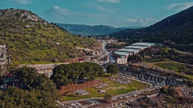 Aerial view of ancient marble street, Roman ruins and stone structures in Ephesus, Izmir, Turkey. Archaeological remains, columns and historic architecture reveal the scale of the ancient city.