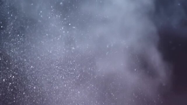 A mesmerizing visual of particles suspended in a hazy atmosphere. Tiny details create a blurry scene with soft edges