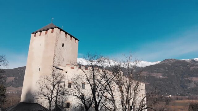Lienz Castle in winter season as seen from drone viewpoint, Austria