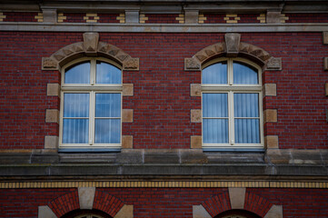 Obraz premium Historic double arched windows on the front façade of Calau Town Hall