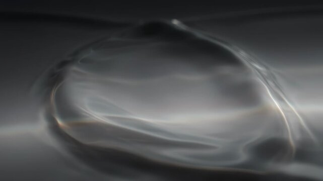 An abstract depiction of a translucent orb floating in a gray background