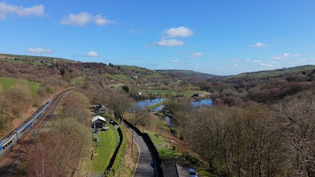 Aerial Drone view of the Sparth Reservoir, Marsden and a passing Train