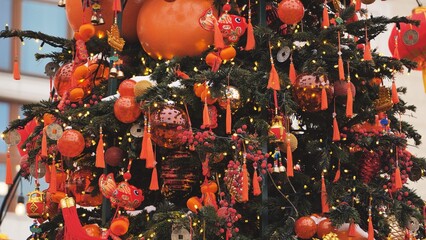 Festive tree celebrating Chinese New Year with traditional red and gold decorations
