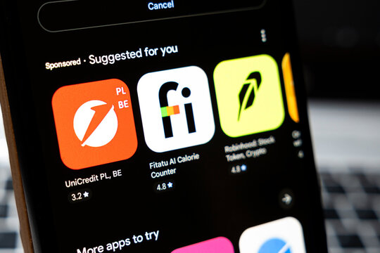 Warsaw, Poland - April 2, 2026: Screenshot of smartphone display showing various app icons including UniCredit PL, BE in a sponsored section, ideal for technology and finance themes.
