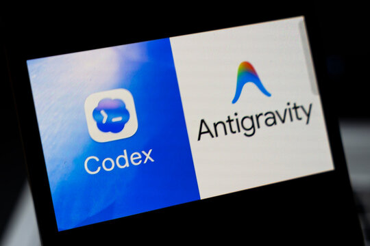 Warsaw, Poland - April 2, 2026: Two app logos displayed on a smartphone screen, showcasing innovative technology. The Codex logo represents coding solutions, while Antigravity signifies advanced tech