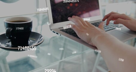 Typing short-sleeved arms on laptop at glass table in cafe, coffee cup and HUD overlays © vectorfusionart
