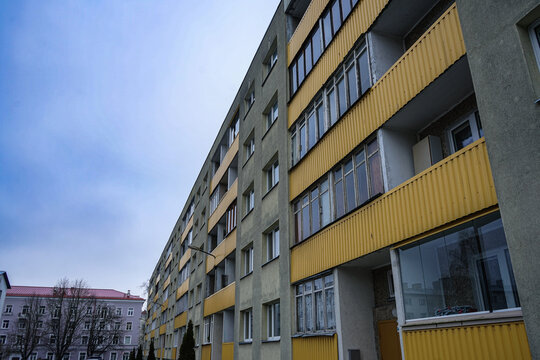 Multi story apartment building with yellow balconies