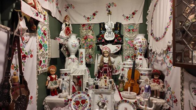 Cultural Memorabilia Display Featuring Hungarian Dolls and Crafts