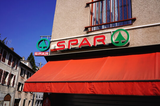 THIERS, FRANCE - MARCH 2, 2026: Close-up of Spar supermarket logo and red awning on facade