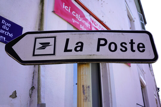 Thiers, France - April 2, 2026: Directional road sign for La Poste, the French postal service