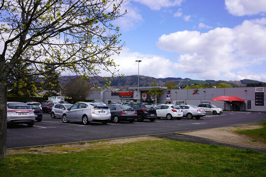 THIERS, FRANCE - MARCH 02, 2026: Intermarche Super store facade and busy parking lot area.