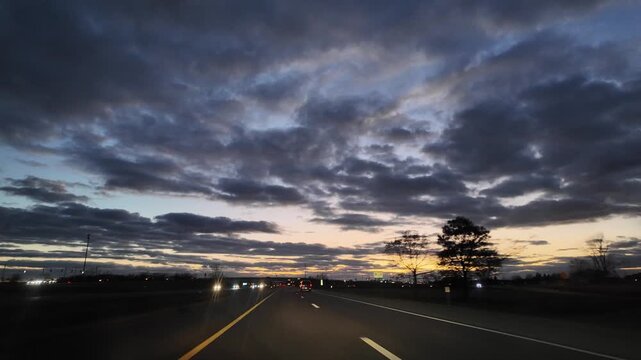 Driving on a Highway During Sunset Under an Overpass in the USA