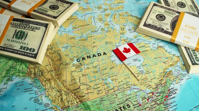 Flag of Canada moved on map surrounded by American dollars symbolizing US investments