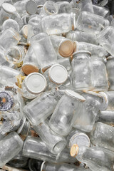 Used glass containers intended for recycling, selective focus.
