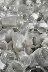 Used glass containers intended for recycling, selective focus.