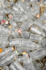 Used glass containers intended for recycling, selective focus.