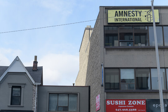 exterior building and sign of Amnesty International Toronto, 1992 Yonge St