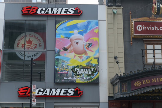 exterior building facade and sign of EB Games, a video game store, located at 267 Yonge St, Toronto (next to Ed Mirvish Theatre)