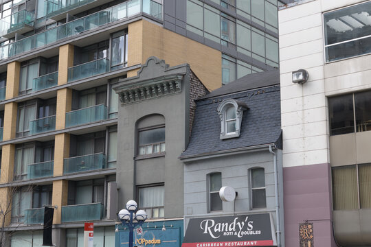 exterior building and signs of Randy's Roti, Caribbean restaurant and Doubles and POPpadum, an Indian restaurant, located 874 Yonge St