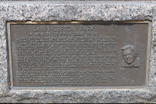 plaque with inscription at Larry Sefton Park, 500 Bay St, Toronto