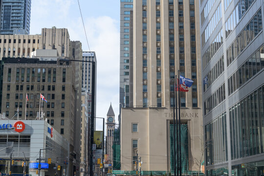 looking north on Bay St to Old City Hall clock and bell tower at Queen W with view of financial institutions at King St W, Toronto