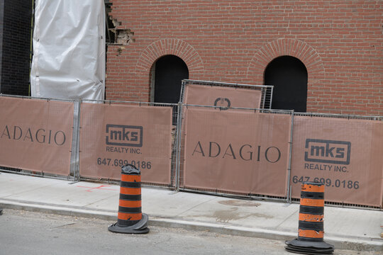 exterior barrier with banner at Adagio, a luxury boutique condo located at 771 Yonge St (and Asquith), Toronto
