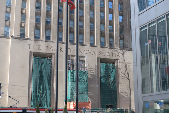 exterior building facade and incised sign of The Bank of Nova Scotia a historic structure located at 44 King St W (northeast corner of Bay St), Toronto