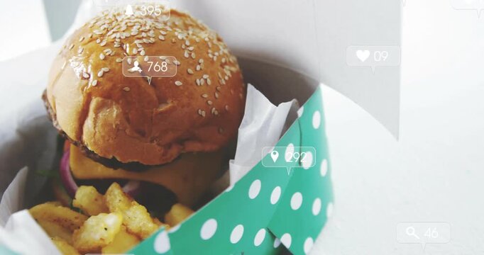 Green polka-dot box entering left, revealing burger and fries, social-media icons promoting reach