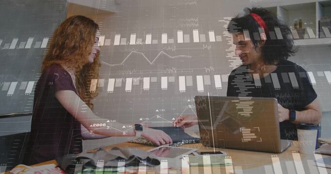 Woman offering swatch toward man, starting design review with laptop charts growing over table