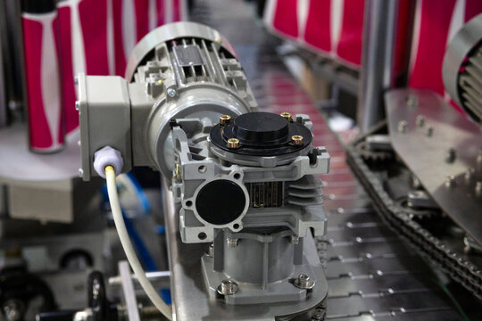 Labeling machine for containers. Packaging machine in production.