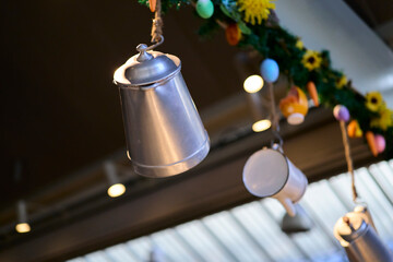Coffee maker. Metal carafes hanging from a kitchen ceiling
