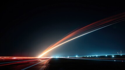 Fototapeta premium 夜空を貫く光の軌跡。長時間露光によるロケット打ち上げの抽象的な光跡。夜の地平線