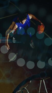 Vertical video: Basketball man bending and dribbling, driving, rising and scoring with hex moving