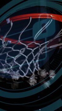 Orange metal basketball rim, knotted rope net and tassels swinging in studio while blue HUD pulsing