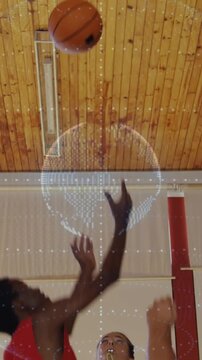 Vertical video: Ref whistling tossing in sports drill, team jumping red holding ball under AR globe