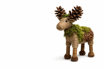 Fototapeta premium Decorative moose made of cones, moss and rope. Space for text.