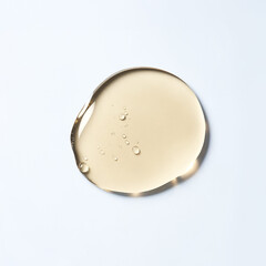 Yellow liquid gel droplet with bubbles on white background cosmetic serum. © Artist Protap