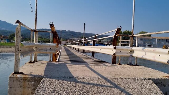 Walking on Concrete Jetty in Roda Corfu Greece POV