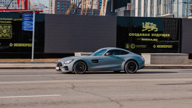car Mercedes Benz AMG GTs on the urban street in motion