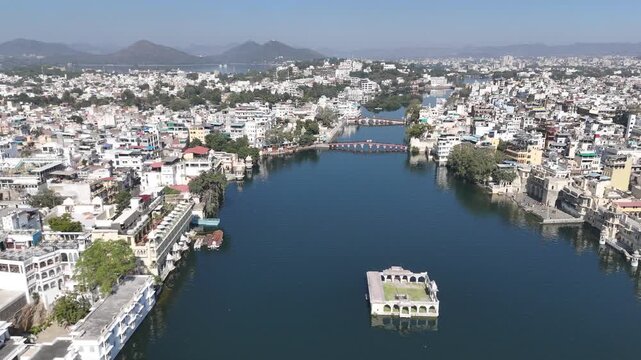 Aerial Flight Over Bridges and Lake Pichola with Mountains in Udaipur India