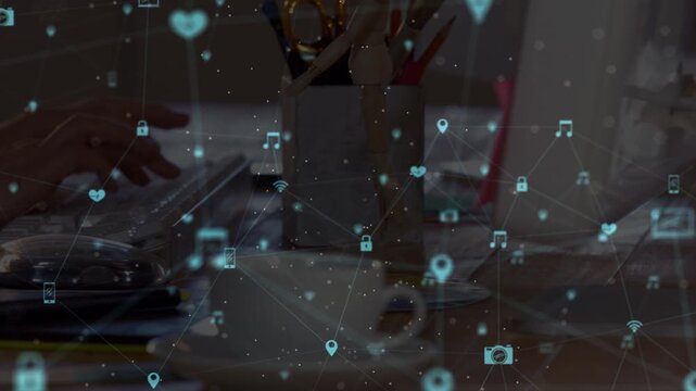 Animation of media icons over hands using computer