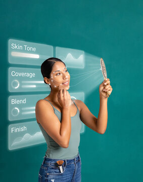 Woman checking makeup with mirror and digital skin interface