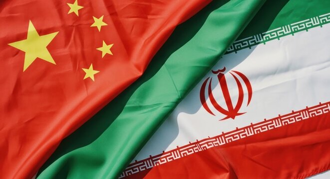 Closeup of Chinese and Iranian flags draped together symbolizing international relations.