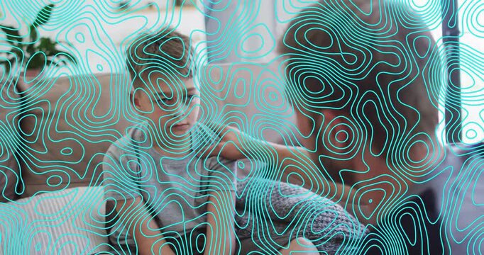 Animation of shapes over caucasian father and son