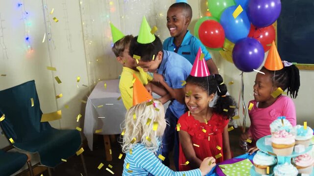 Celebrating birthday party, children throwing confetti over colorful decorations