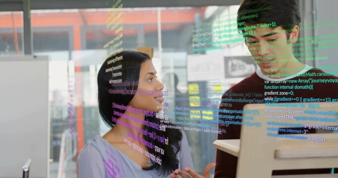 woman gesturing at screen initiating code overlay for code review while male colleague leaning in