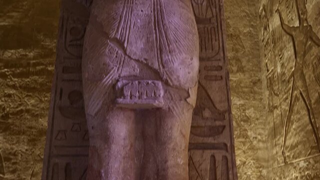 Ancient Egyptian statue with detailed hieroglyphs and ritual scenes inside the Abydos Temple, revealing sacred art, mythology, and preserved history. Egypt.