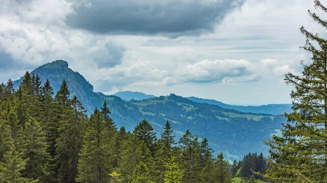 Time lapse of dancing clouds above the mountains. Mountain landscape. Switzerland.