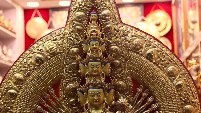 budhdha in stending pose with multiple heads idol